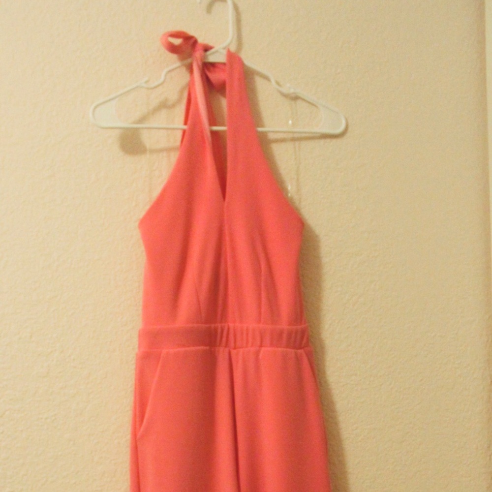 Pink Dillards Halter Top Jumpsuit. Size is XS but is very stretchy. Worn once.